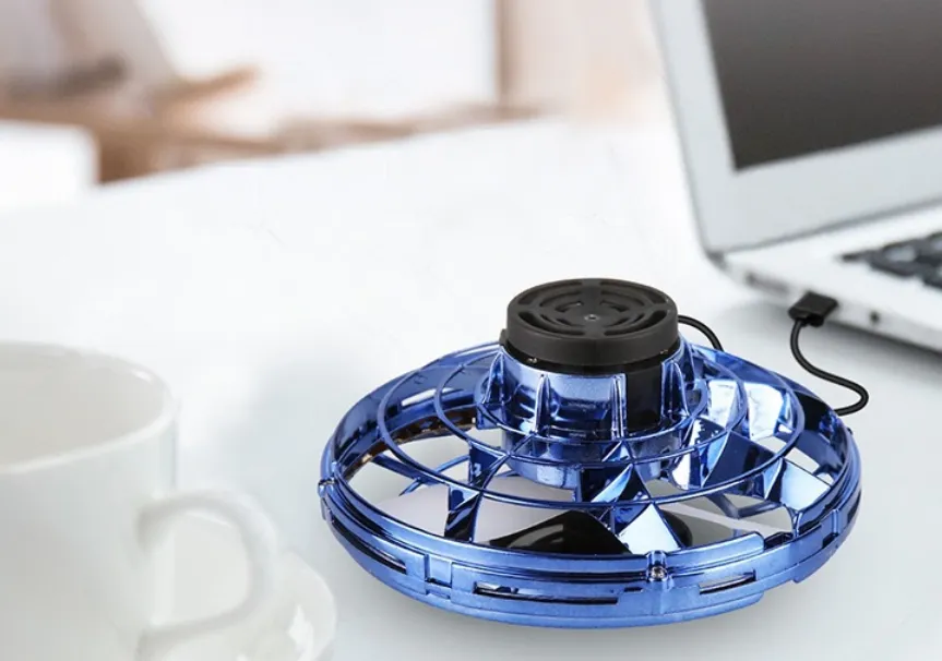 Mini Fingertip Gyro Drone with LED, UFO design, and interactive spinning feature for kids