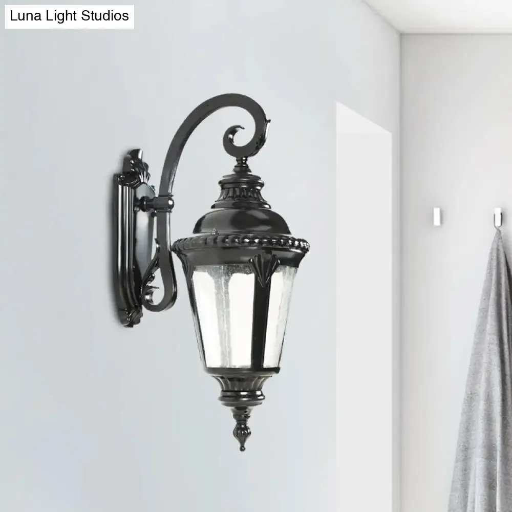 Rustic Courtyard Wall Lighting: 1-Light Sconce with Urn Clear Seeded Glass Shade in Black